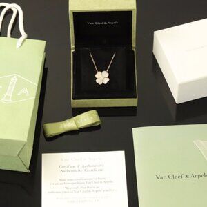 Van Cleef & Arpels Cosmos medium model clip pendant, 18K rose gold, white mother